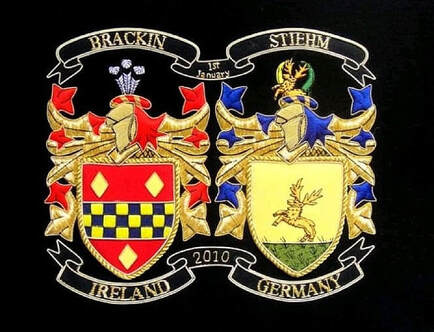 Family crest embroidery with shield supporter